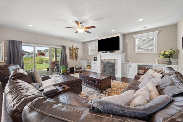 1869 Paloma Ct, Lafayette, IN 47909 - living area with ceiling fan, dark wood finished floors, a stone fireplace, and recessed lighting
