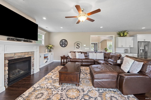 1869 Paloma Ct, Lafayette, IN 47909 - living room with a ceiling fan, a fireplace, dark wood-style floors, arched walkways, and recessed lighting