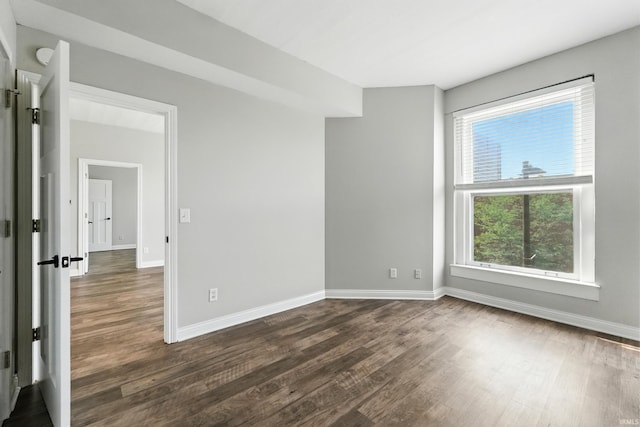 112 W Washington Blvd Unit 329, Fort Wayne, IN 46802 - empty room with dark wood-type flooring and baseboards