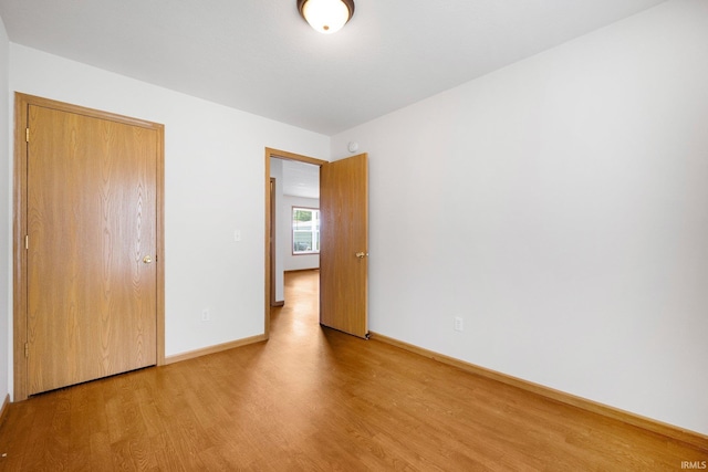 3610 E Sherwood Ter, Fort Wayne, IN 46806 - unfurnished bedroom with wood finished floors and a closet