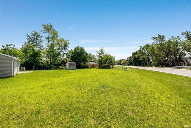 3610 E Sherwood Ter, Fort Wayne, IN 46806 - view of grassy yard with a storage unit