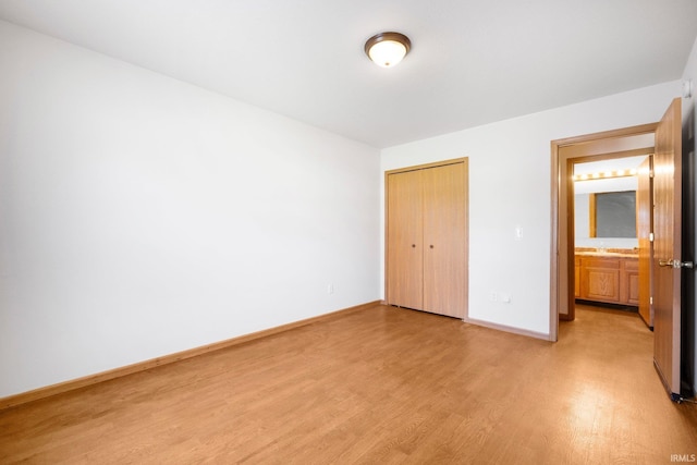 3610 E Sherwood Ter, Fort Wayne, IN 46806 - unfurnished bedroom with light wood-style floors and a closet