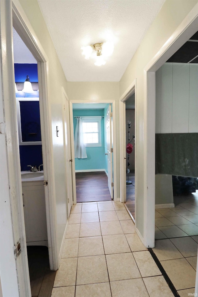 2907 Prairie Ln, Lafayette, IN 47904 - hall with light tile patterned floors and a textured ceiling
