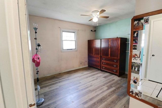 2907 Prairie Ln, Lafayette, IN 47904 - unfurnished bedroom with wood finished floors and a ceiling fan