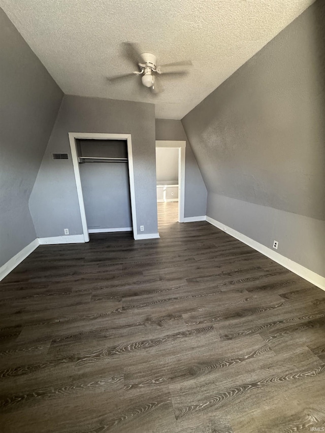 2806 S Walnut St, Muncie, IN 47302 - additional living space with ceiling fan, lofted ceiling, a textured ceiling, and dark wood-style floors