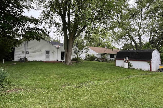 615 Springbrook Rd, Fort Wayne, IN 46825 - view of grassy yard featuring a storage unit