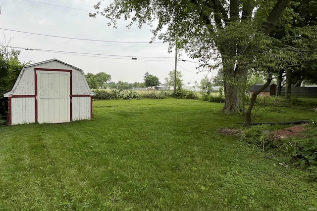 615 Springbrook Rd, Fort Wayne, IN 46825 - view of grassy yard featuring a storage shed