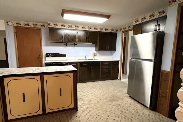 615 Springbrook Rd, Fort Wayne, IN 46825 - kitchen featuring electric range oven, freestanding refrigerator, light countertops, and dark brown cabinetry