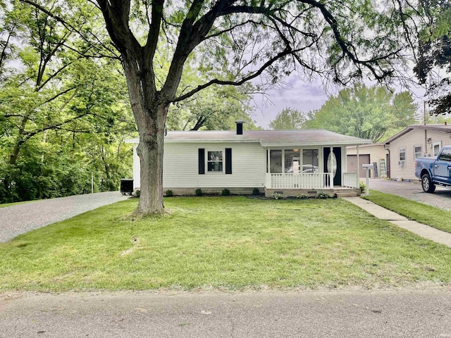 210 Gladstone Dr, Wabash, IN 46992 - view of front of house featuring a porch and a front lawn