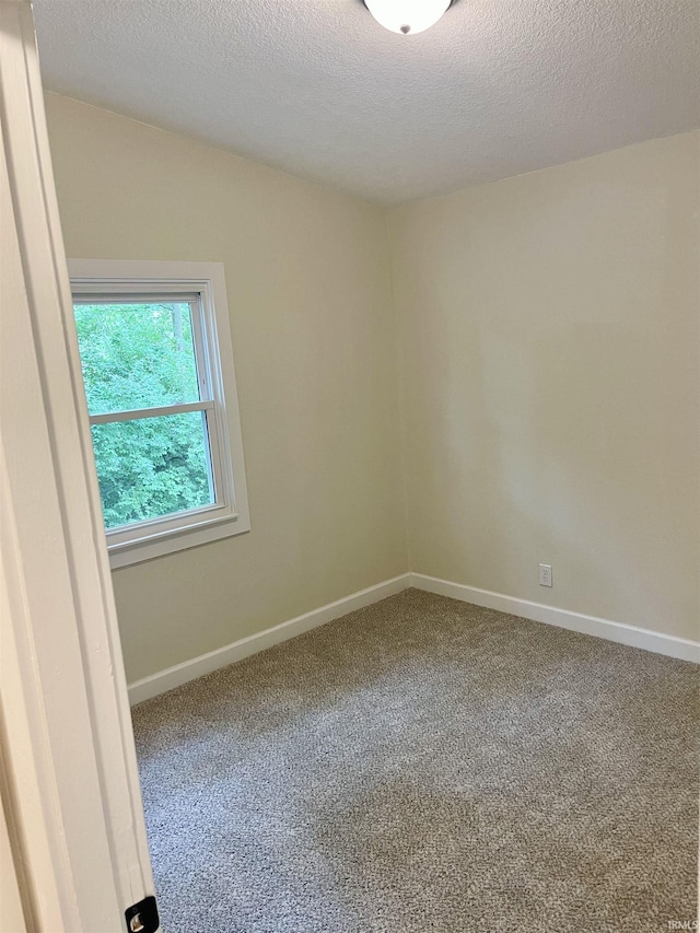 210 Gladstone Dr, Wabash, IN 46992 - carpeted empty room featuring a textured ceiling and baseboards