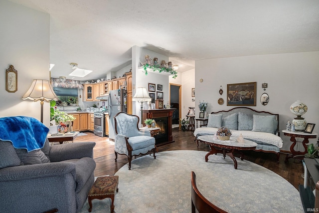 205 Par Blvd, Bristol, IN 46507 - living room with a skylight, light wood-style flooring, a fireplace, and vaulted ceiling