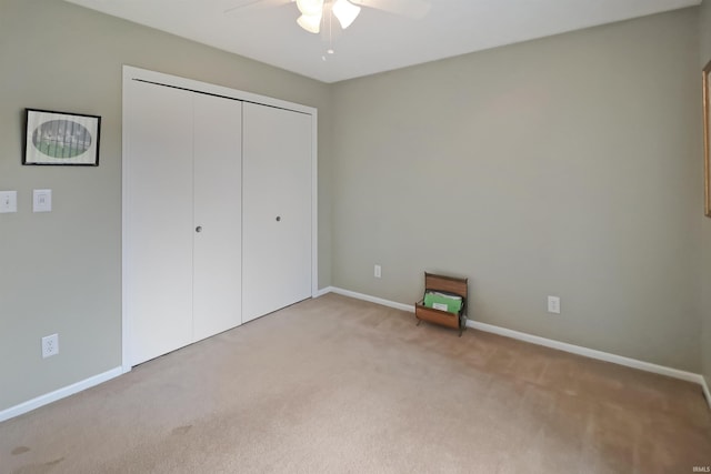 3847 Lodi Ln, Lafayette, IN 47905 - unfurnished bedroom featuring light carpet, a closet, and a ceiling fan