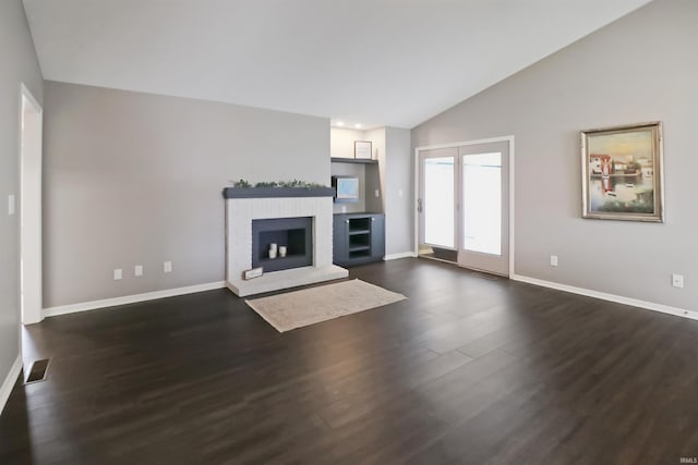 3847 Lodi Ln, Lafayette, IN 47905 - unfurnished living room featuring dark wood-type flooring, a fireplace, and high vaulted ceiling