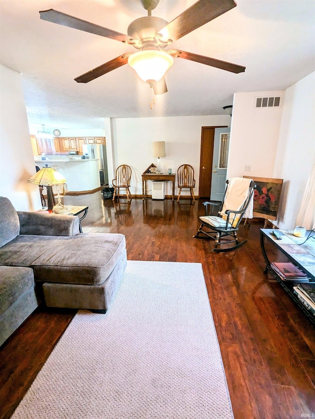 11497 N Biscayne Ln, Cromwell, IN 46732 - living room featuring wood finished floors and ceiling fan