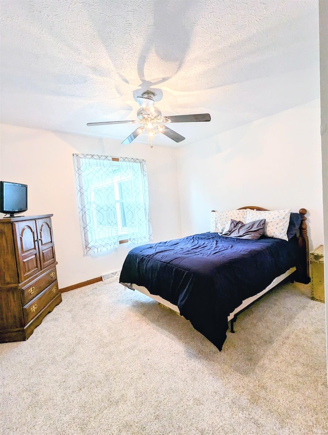 11497 N Biscayne Ln, Cromwell, IN 46732 - bedroom with a textured ceiling, carpet, and a ceiling fan