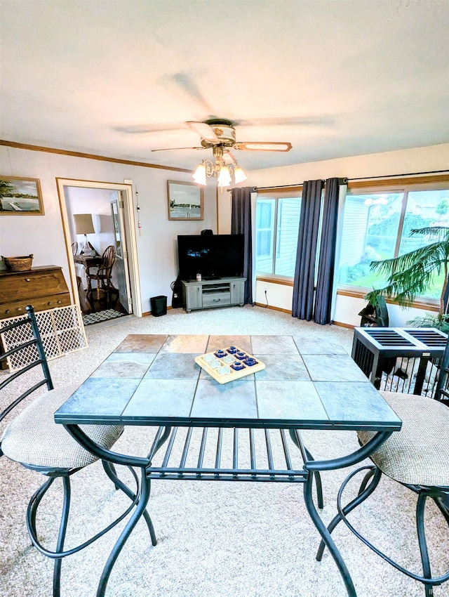 11497 N Biscayne Ln, Cromwell, IN 46732 - carpeted living area featuring a ceiling fan and crown molding