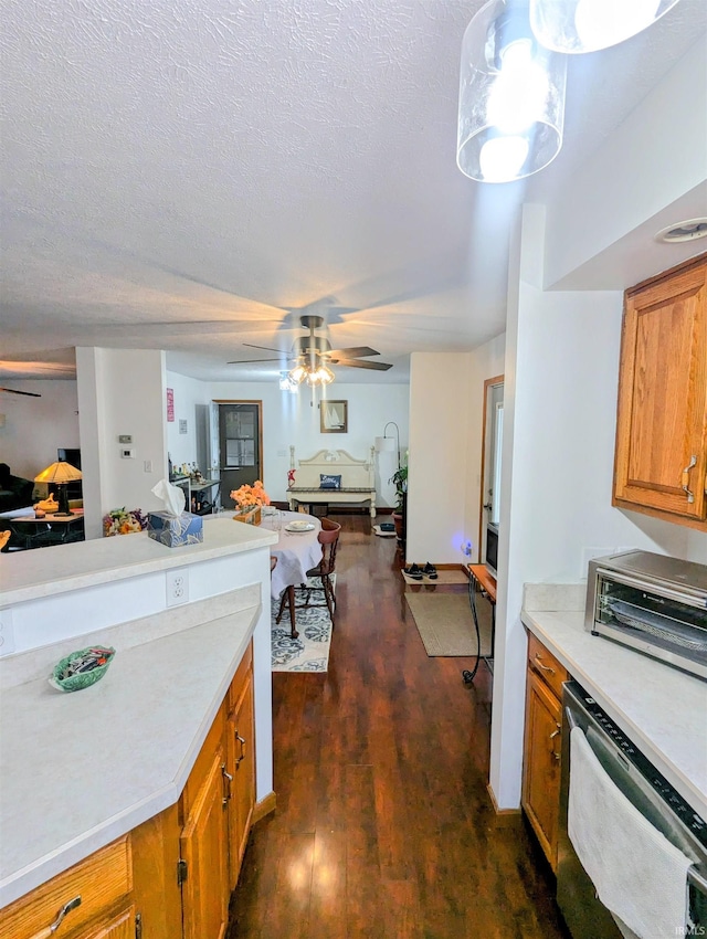 11497 N Biscayne Ln, Cromwell, IN 46732 - kitchen featuring open floor plan, ceiling fan, brown cabinetry, light countertops, and dark wood finished floors