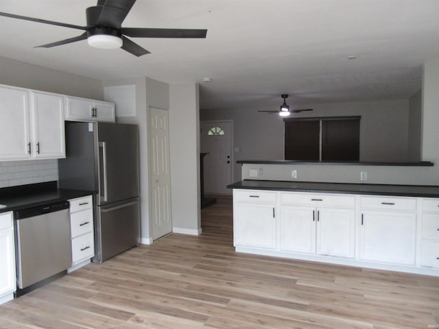2305 Hillis Ct, Kokomo, IN 46902 - kitchen featuring appliances with stainless steel finishes, ceiling fan, dark countertops, and white cabinetry