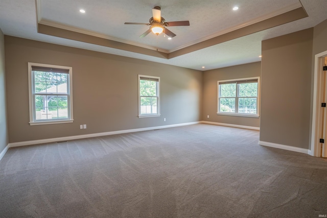 3507 Wakefield Dr, West Lafayette, IN 47906 - unfurnished room featuring a raised ceiling, carpet floors, plenty of natural light, ornamental molding, and a ceiling fan