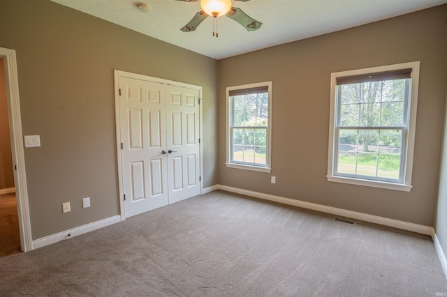 3507 Wakefield Dr, West Lafayette, IN 47906 - unfurnished bedroom with carpet floors, a closet, and a ceiling fan