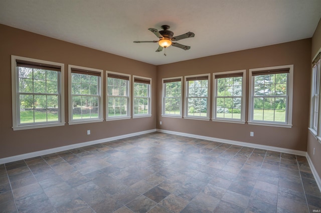 3507 Wakefield Dr, West Lafayette, IN 47906 - unfurnished room featuring ceiling fan, healthy amount of natural light, and dark stone finish flooring