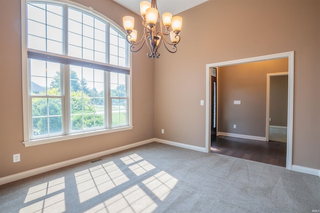 3507 Wakefield Dr, West Lafayette, IN 47906 - carpeted empty room with a chandelier and a towering ceiling