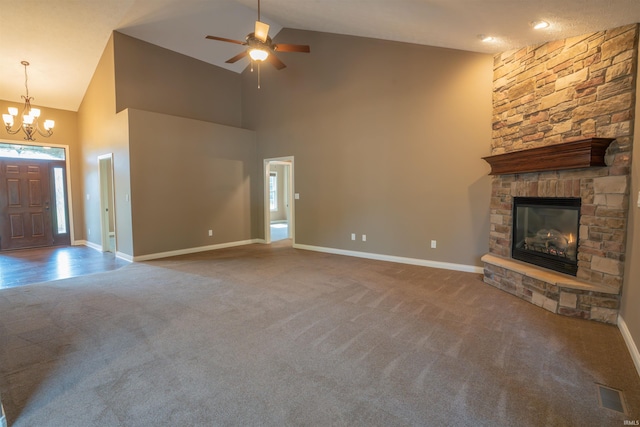 3507 Wakefield Dr, West Lafayette, IN 47906 - unfurnished living room with carpet flooring, a stone fireplace, high vaulted ceiling, a chandelier, and a ceiling fan