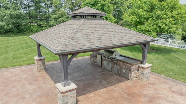 3507 Wakefield Dr, West Lafayette, IN 47906 - view of patio / terrace featuring a gazebo, exterior kitchen, and a garage