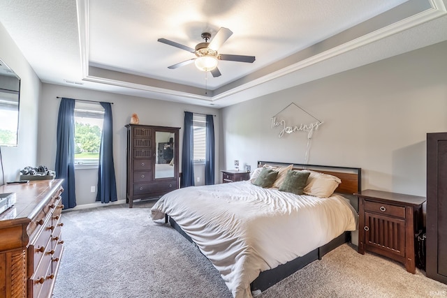 1492 Monte Carlo Dr, Huntertown, IN 46748 - bedroom featuring light colored carpet, multiple windows, and a tray ceiling