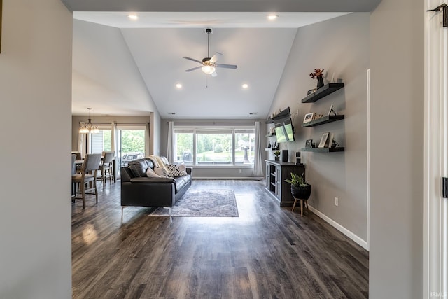 1492 Monte Carlo Dr, Huntertown, IN 46748 - living room with high vaulted ceiling, dark wood-type flooring, ceiling fan, a chandelier, and recessed lighting