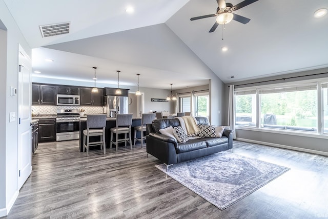 1492 Monte Carlo Dr, Huntertown, IN 46748 - living area with ceiling fan, high vaulted ceiling, dark wood-style floors, recessed lighting, and a chandelier