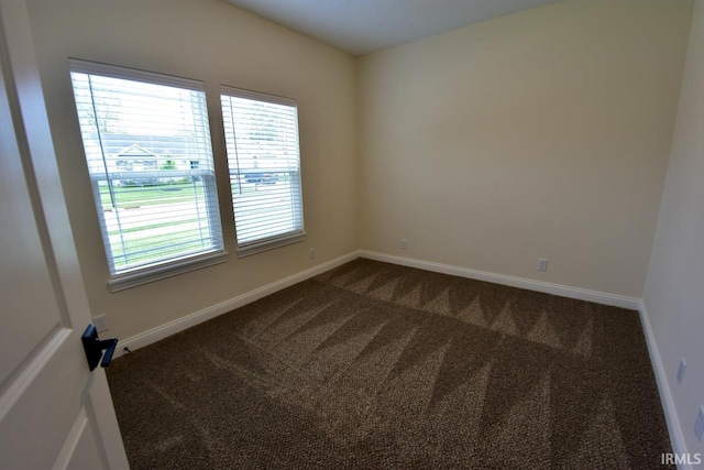 146 Hayloft Dr, West Lafayette, IN 47906 - spare room featuring dark carpet and baseboards