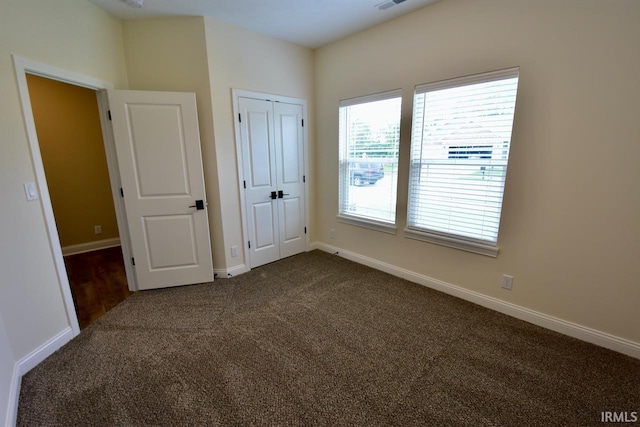 146 Hayloft Dr, West Lafayette, IN 47906 - unfurnished bedroom with dark carpet and a closet