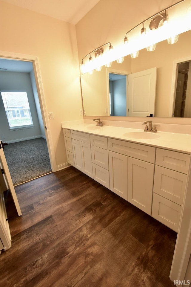 146 Hayloft Dr, West Lafayette, IN 47906 - bathroom featuring double vanity and wood finished floors