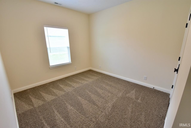 146 Hayloft Dr, West Lafayette, IN 47906 - spare room featuring dark colored carpet and baseboards