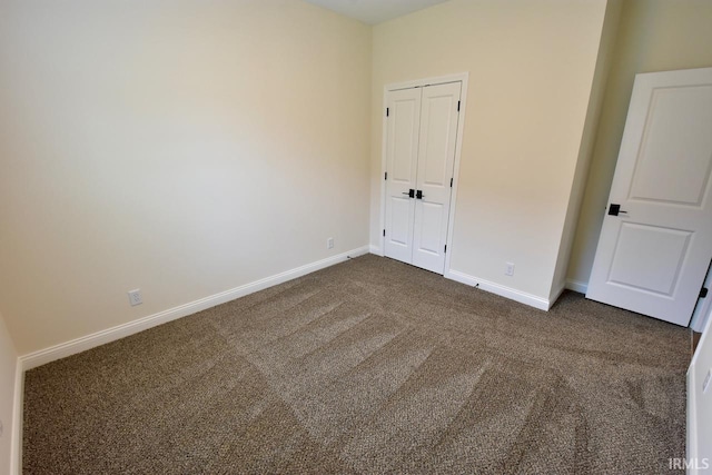 146 Hayloft Dr, West Lafayette, IN 47906 - unfurnished bedroom with dark carpet and a closet