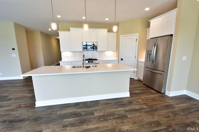 146 Hayloft Dr, West Lafayette, IN 47906 - kitchen featuring stainless steel appliances, an island with sink, white cabinetry, tasteful backsplash, and recessed lighting