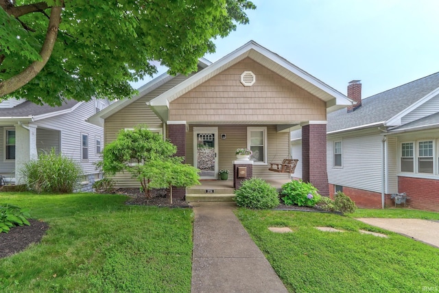 2736 Marion Ave, Evansville, IN 47712 - view of front of house featuring covered porch and a front yard