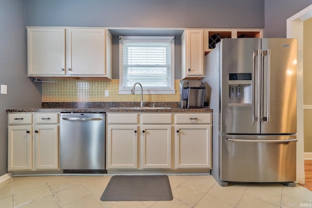 2736 Marion Ave, Evansville, IN 47712 - kitchen featuring stainless steel appliances, decorative backsplash, white cabinets, and dark stone countertops
