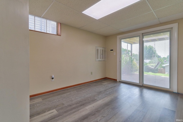 2736 Marion Ave, Evansville, IN 47712 - empty room with a drop ceiling, healthy amount of natural light, and wood finished floors