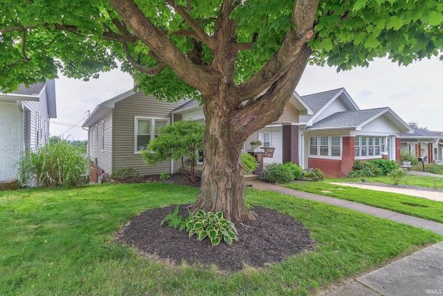 2736 Marion Ave, Evansville, IN 47712 - obstructed view of property with a front yard and brick siding