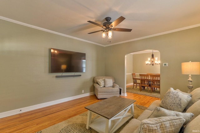 2736 Marion Ave, Evansville, IN 47712 - living area with arched walkways, a chandelier, wood finished floors, crown molding, and a ceiling fan