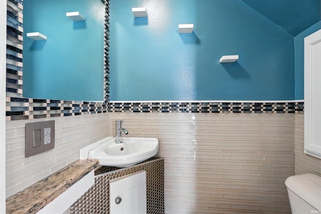 1015 Columbia Ave, Fort Wayne, IN 46805 - half bathroom with vanity and tile walls