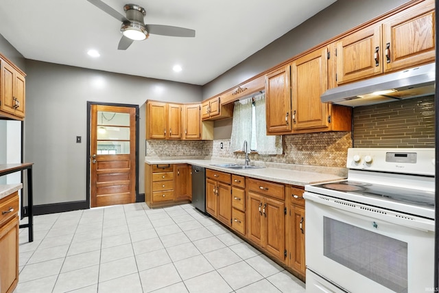 1015 Columbia Ave, Fort Wayne, IN 46805 - kitchen featuring electric stove, under cabinet range hood, dishwashing machine, and light countertops