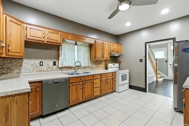 1015 Columbia Ave, Fort Wayne, IN 46805 - kitchen featuring dishwasher, white electric range, freestanding refrigerator, under cabinet range hood, and ceiling fan