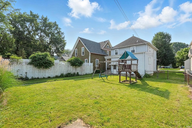 1015 Columbia Ave, Fort Wayne, IN 46805 - rear view of property with a playground and a fenced backyard