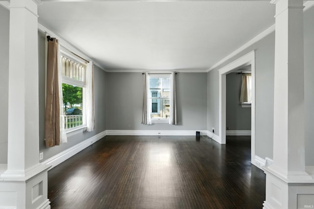 1015 Columbia Ave, Fort Wayne, IN 46805 - empty room with ornate columns, dark wood-type flooring, and ornamental molding