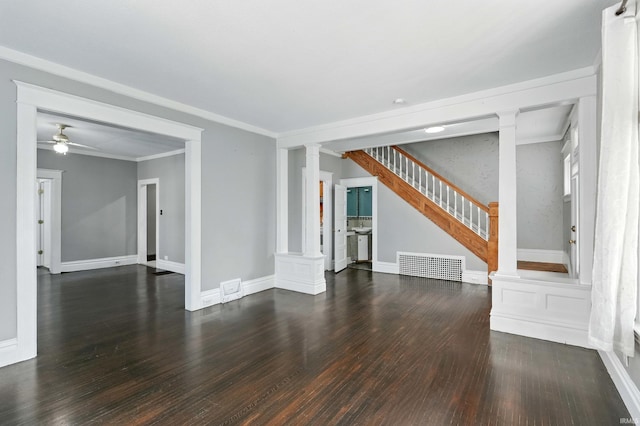 1015 Columbia Ave, Fort Wayne, IN 46805 - unfurnished living room featuring decorative columns, wood finished floors, ceiling fan, ornamental molding, and stairway