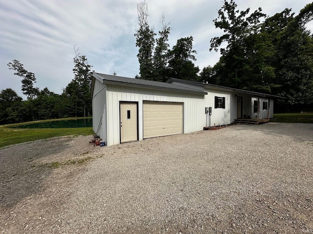 13687 E Ivan Ct, Bloomington, IN 47403 - garage with gravel driveway