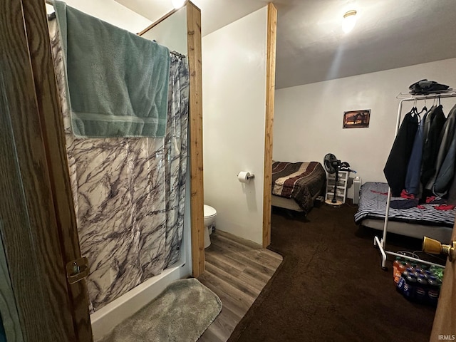 13687 E Ivan Ct, Bloomington, IN 47403 - bathroom with a shower with curtain and wood finished floors